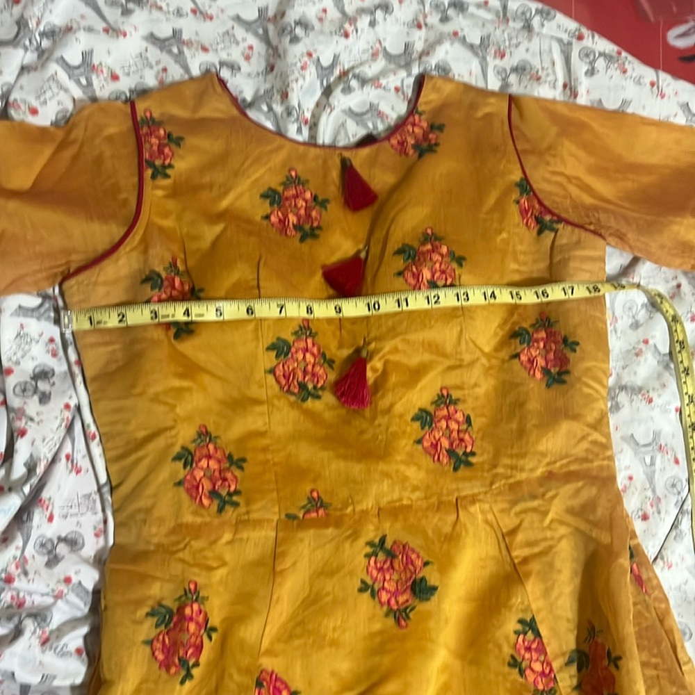 This is Indian anarkali gown with legging and duppata.